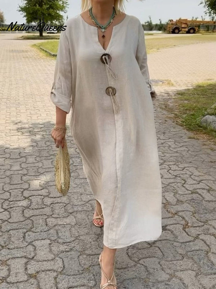 Noor – Long dress with wooden details and loose sleeves